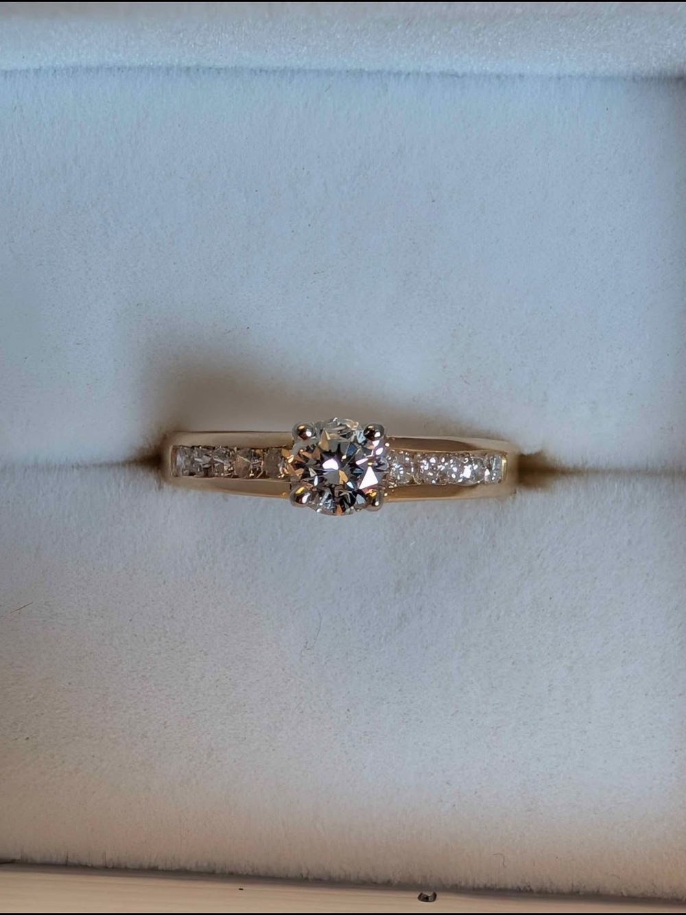 Gold Solitaire Engagement Ring with Side Accent Diamonds